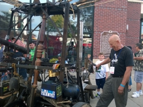 Steve Hay and his ornithopter, outside the entrance to the Expo Center