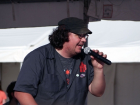 An enthusiastic announcer with the Power Racing Series