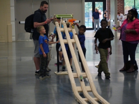 Young makers trying their new creations on the race track