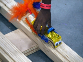 Young makers trying their new creations on the race trac