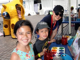 Mackenzie and Jayson from Whitefish Bay with Janelle at the Kohl's Color Wheels tent