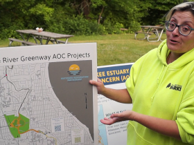 Natalie Dutack, Area of Concern program supervisor with Milwaukee County Parks, describes the Kletzsch fishway project and other projects to rehabilitate the Milwaukee Estuary “AOC” at a June 2023 meeting in Kletzsch Park. The Kletzsch fishway plan took seven years to develop in response to local public concerns.
