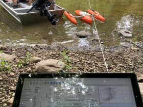 Dr. John Janssen with the UW-Milwaukee School of Freshwater Sciences maneuvers the boat in the Milwaukee River during 2023 fieldwork. Houghton’s team used an Acoustic Doppler Current Profiler attached to a dingy tow to collect detailed stream velocity data at a number of river transects. The field observations are needed to calibrate the HEC-RAS model.