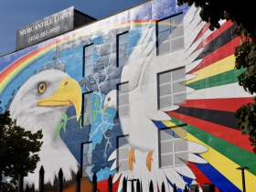 The iconic 'Mural of Peace' by Reynaldo Hernandez, which can be seen from I-42, is located on South 6th Street