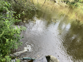 A pump draws Milwaukee River water up to the trailer at Riveredge