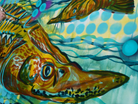 Milwaukee artist John Kowalczyk paints a sturgeon mural board for Harbor District, Inc. at Harbor Fest 2023