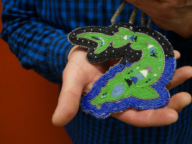 Mark Denning shows the emblem of his Sturgeon Clan. The silver represents people who are stargazers