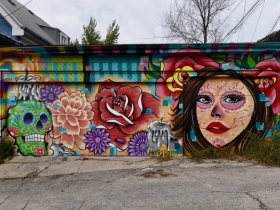 Ramiro Sandoval Argueta painted this Day of the Dead themed mural in the alley behind his tattoo shop, off West National Avenue and South 33rd Street