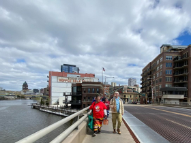 Walkers cross the Milwaukee River after its confluence with the Menomonee heading south on Water Street