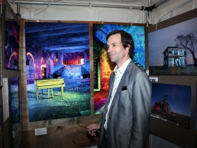 Brett Waterhouse viewing the photography of Chris and Katie Robleski
