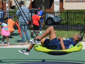 A child relaxes at Columbia Playfield on the day of its reopening