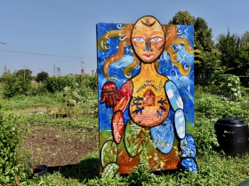 This Artists Work in Education mural in Alice's Garden was painted by Gabrielle Tesfaye and youths from Neu-Life Community Development to honor the story of Caroline Quarlls and her experience with the Underground Railroad