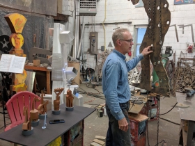 Artist Richard Taylor in his studio while sculptures in production