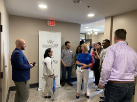 Sen. Tammy Baldwin greeting people at Concordia 27 ribbon cutting