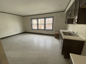 Main living area of one bedroom apartment still under development in Concordia 27 project