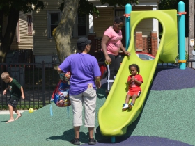 Children play at Columbia Playfield on the day of its reopening