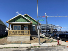 New county human services building rises behind Habitat for Humanity Home. Photo by Graham Kilmer.