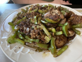 Chicken livers with sautéed peppers and onions