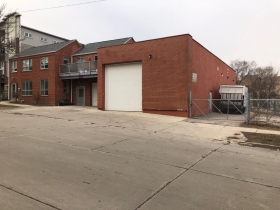 Site of a proposed five-story, 76-unit apartment building