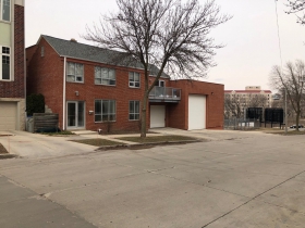 Site of a proposed five-story, 76-unit apartment building