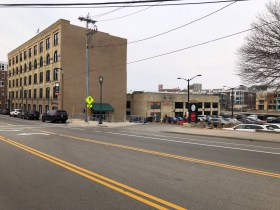 Ogden's headquarters is across the street from the site of a proposed five-story, 76-unit apartment building