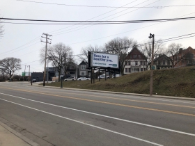 Site of a proposed five-story, 76-unit apartment building