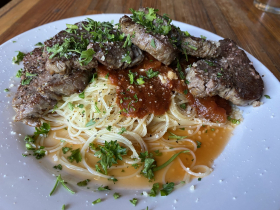 Steak medallions with angel hair pasta and marinara sauce