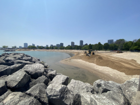 Bulldozer pushing sand