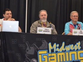 L to R a moderator, Disney animator Philo Barnhart and Darkwing Duck creator Tad Stones
