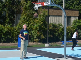 Mayor Tom Barrett tries out the new basketball courts at Custer Playfield