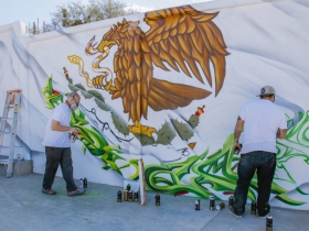 (From left) Ben Stark and Chacho Lopez work their finishing touches of the Mexico flag.