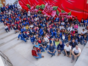 (Bottom right) Ben Stark and Chacho Lopez sit with Telesecundaria students and faculty.