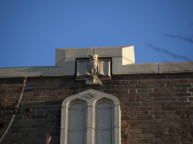 Merlons patterned with owls surround the parapet at Marquette University High, modeled by the American Terra Cotta & Ceramic Co. in 1924.