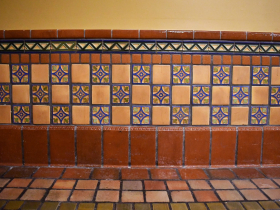 Detail of the dado, or lower section of a wall, with Continental tulip tiles