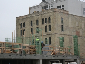 Even on this cold and cloudy day work continues at The Brewery.