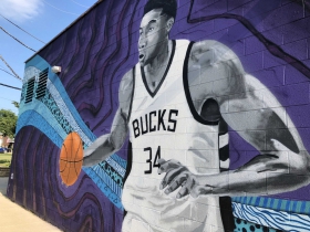 Giannis Antetokounmpo mural by Fred Kaems located at 3600 S. Clement Ave.