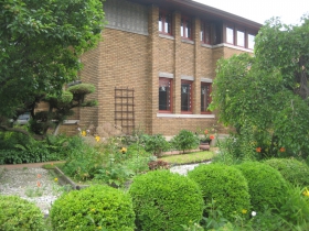 The trellis is not original to the home, and awaits a plant to fill its frame.