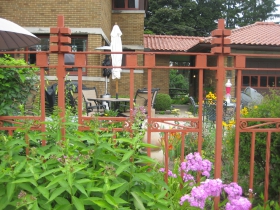 ​We've got some crazy phlox here by the fence, original to the home, and designed by the architect Russell Barr Williamson. Note the civilized covered walkway bridging the home and its contemporaneous garage.