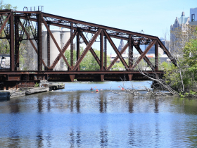 Kayakers Near Power House Construction