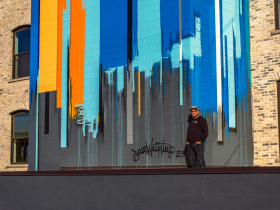 Dave Watkins With His River Place Mural Aside Finishing House