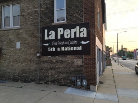 Sign for La Perla