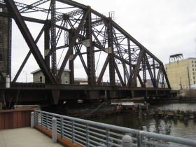 Train bridge next to The Point on the River.