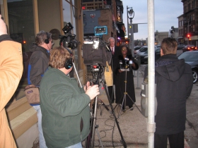 The media looks on