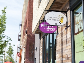 Clock Shadow Creamery and Purple Door Sign