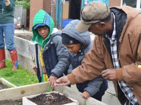 Kids learn how to put a worm on a hook