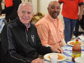 Mayor Tom Barrett and DNR Secretary-designee Preston Cole sample the freshly fried fish