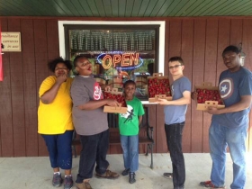 Strawberry picking at the Urban Ecology Center.